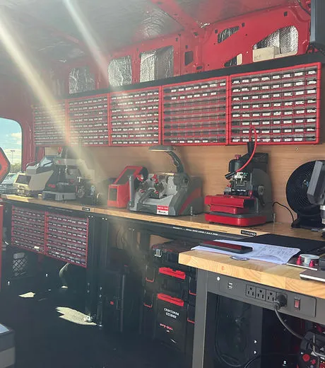 Inside a Lock Guys mobile van: key-cutting machines, transponder programmers and rows of key blanks on the workbench